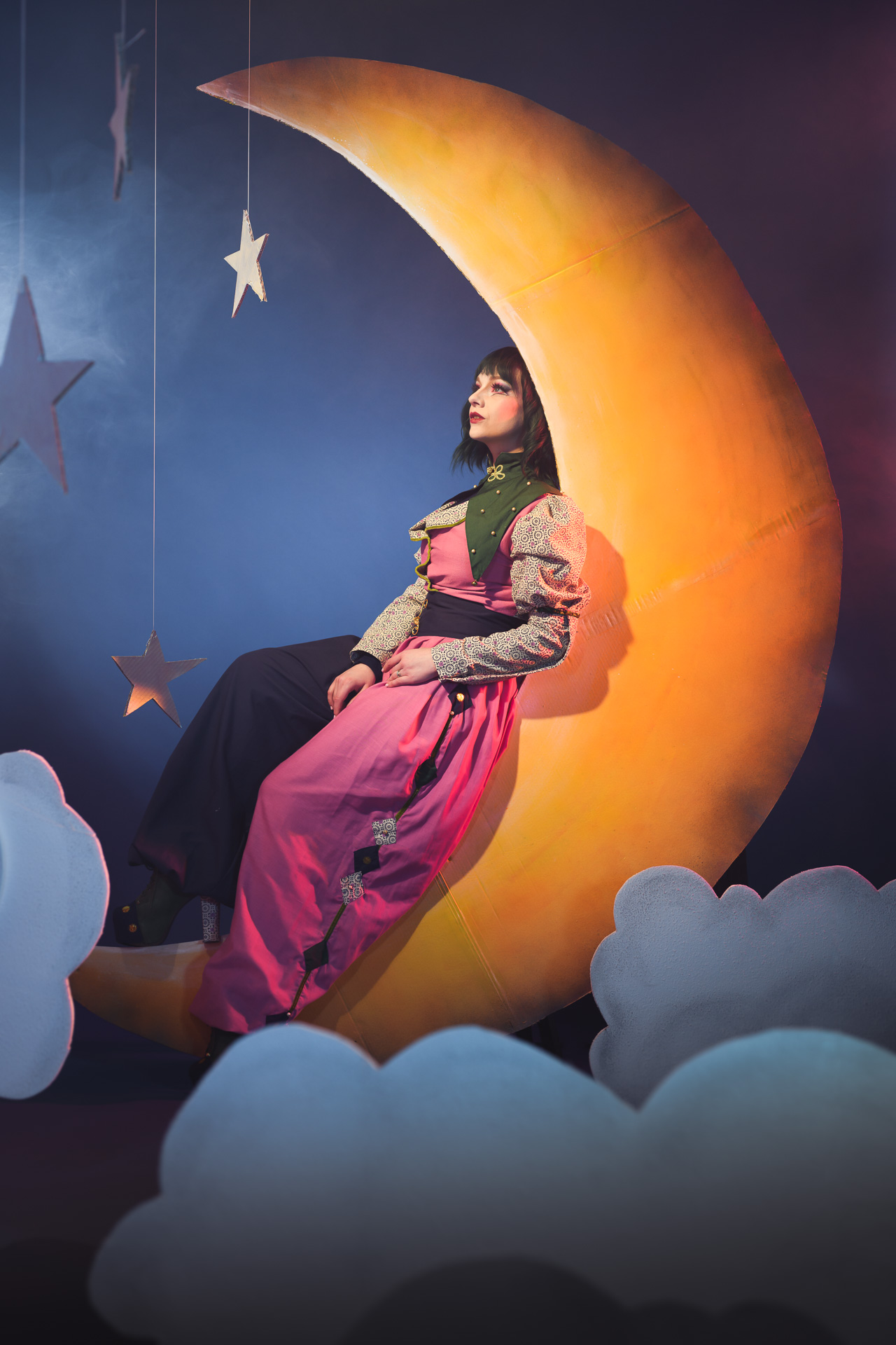 a woman sitting on a moon